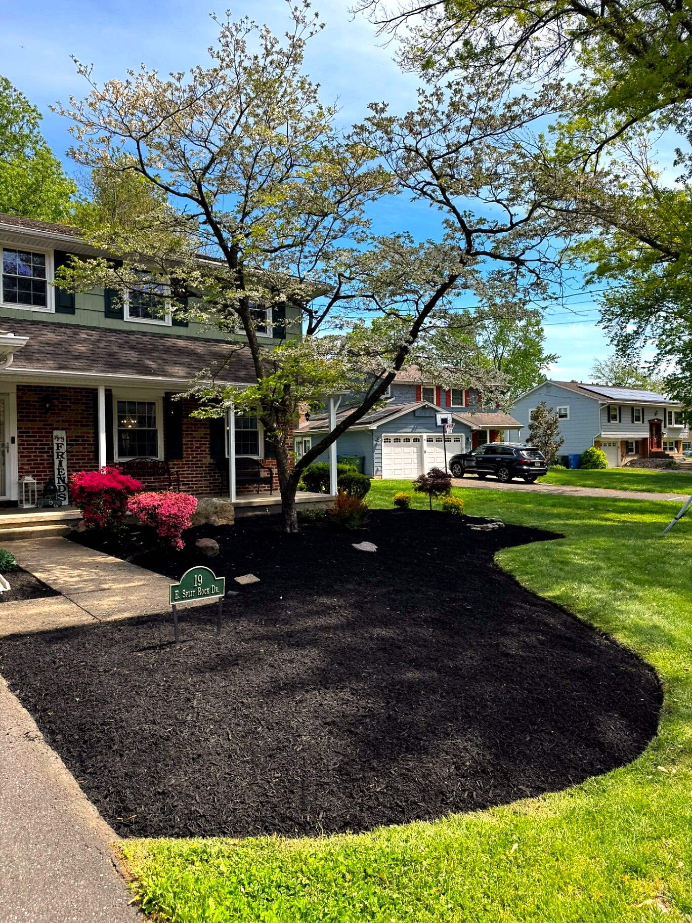 Front yard landscaping — Voorhees, NJ Front yard landscaping with fresh mulch and new plants in Voorhees, NJ
